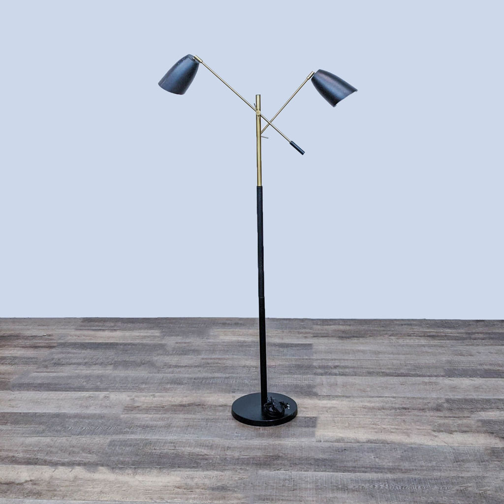 Modern floor lamp with adjustable arms and black shades on a wooden floor by Reperch.