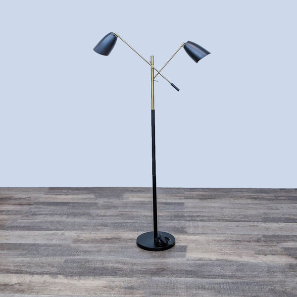 Modern floor lamp with adjustable arms and black shades on a wooden floor by Reperch.