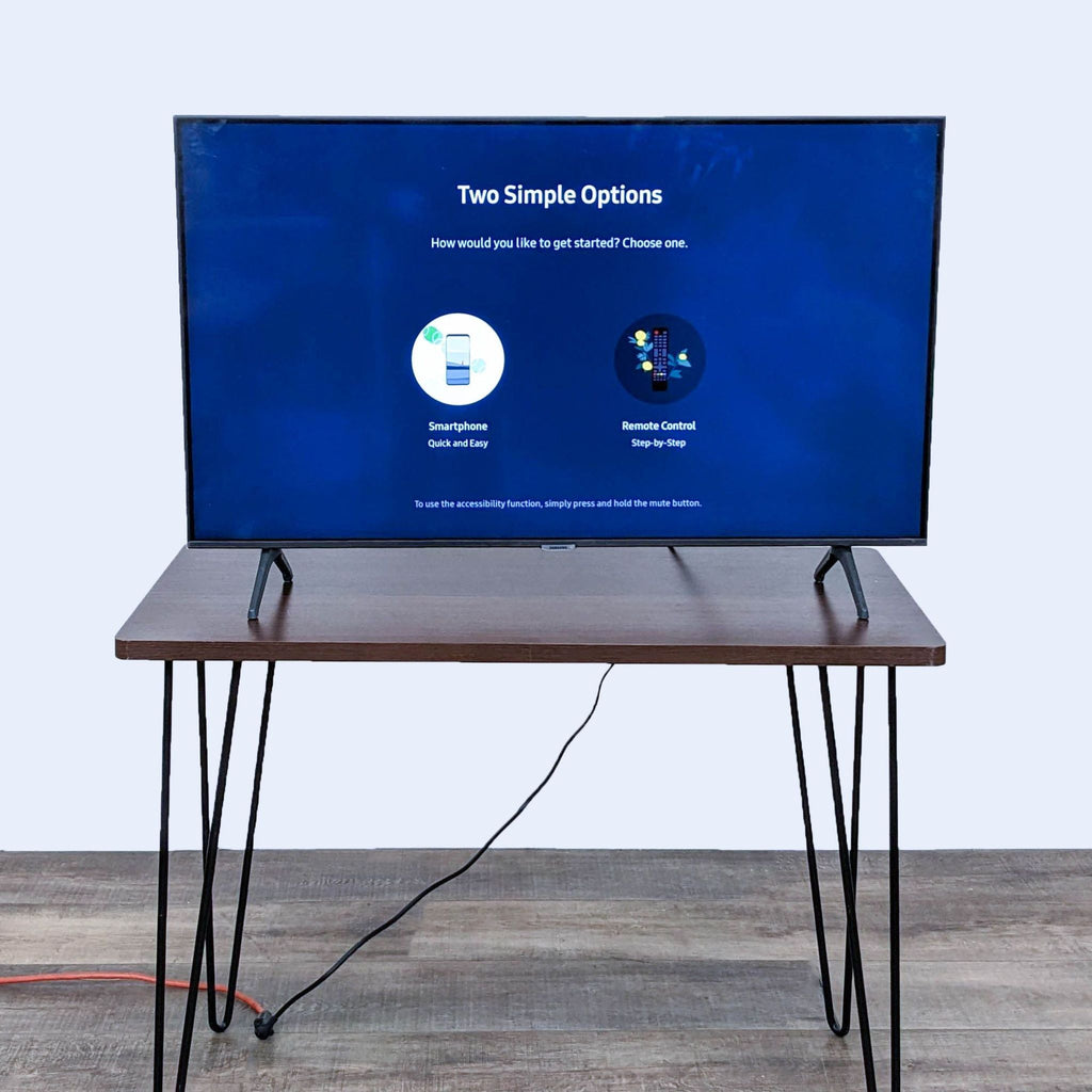 Samsung TV setup screen with smartphone and remote options.