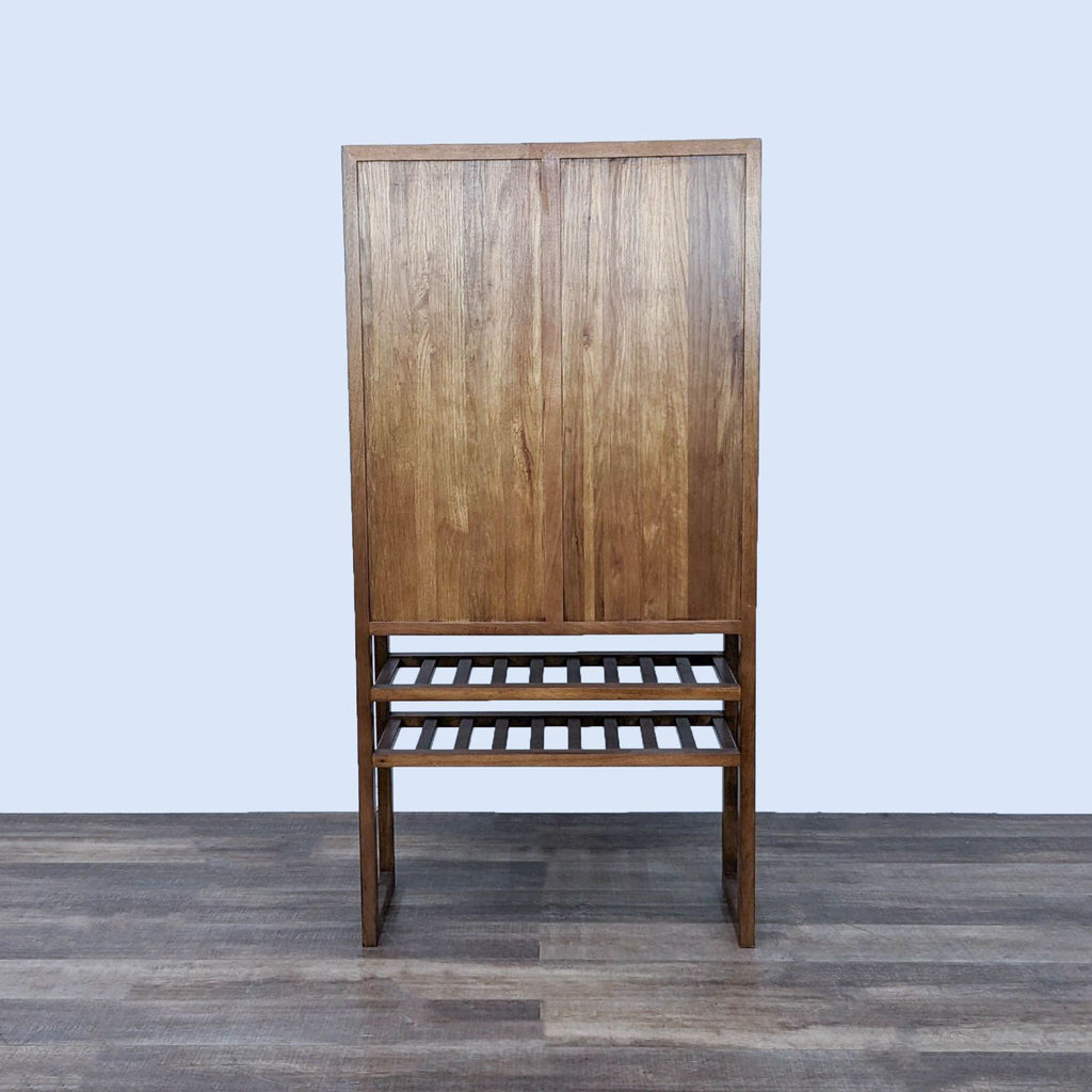 Back view of Reperch cabinet, showcasing wood finish and lower shelf details.