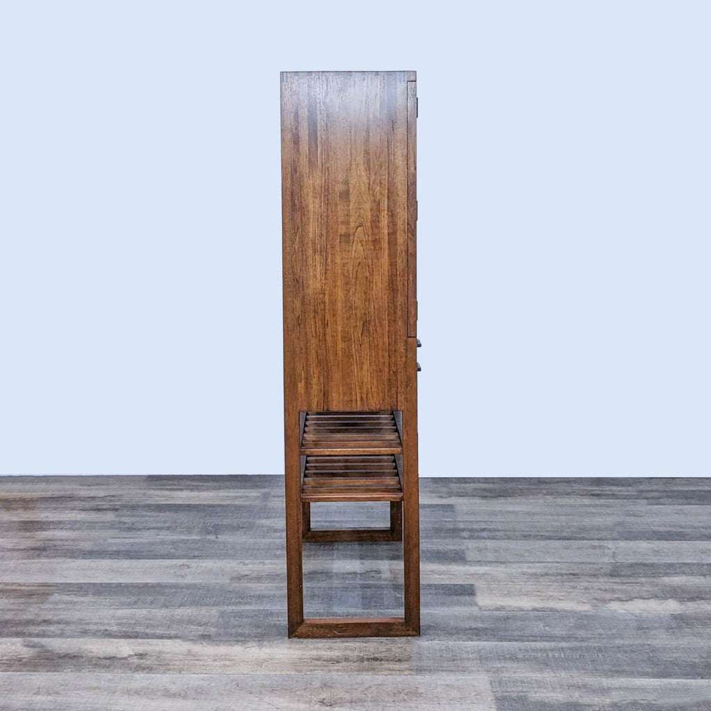 Side profile of Reperch cabinet, highlighting the slim design and slatted shelves.