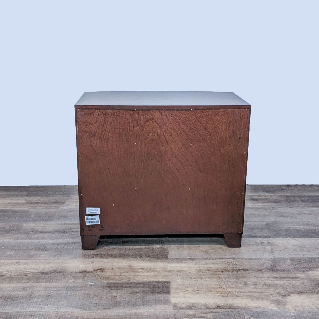 Back view of wooden Ethan Allen nightstand with dark stain finish.