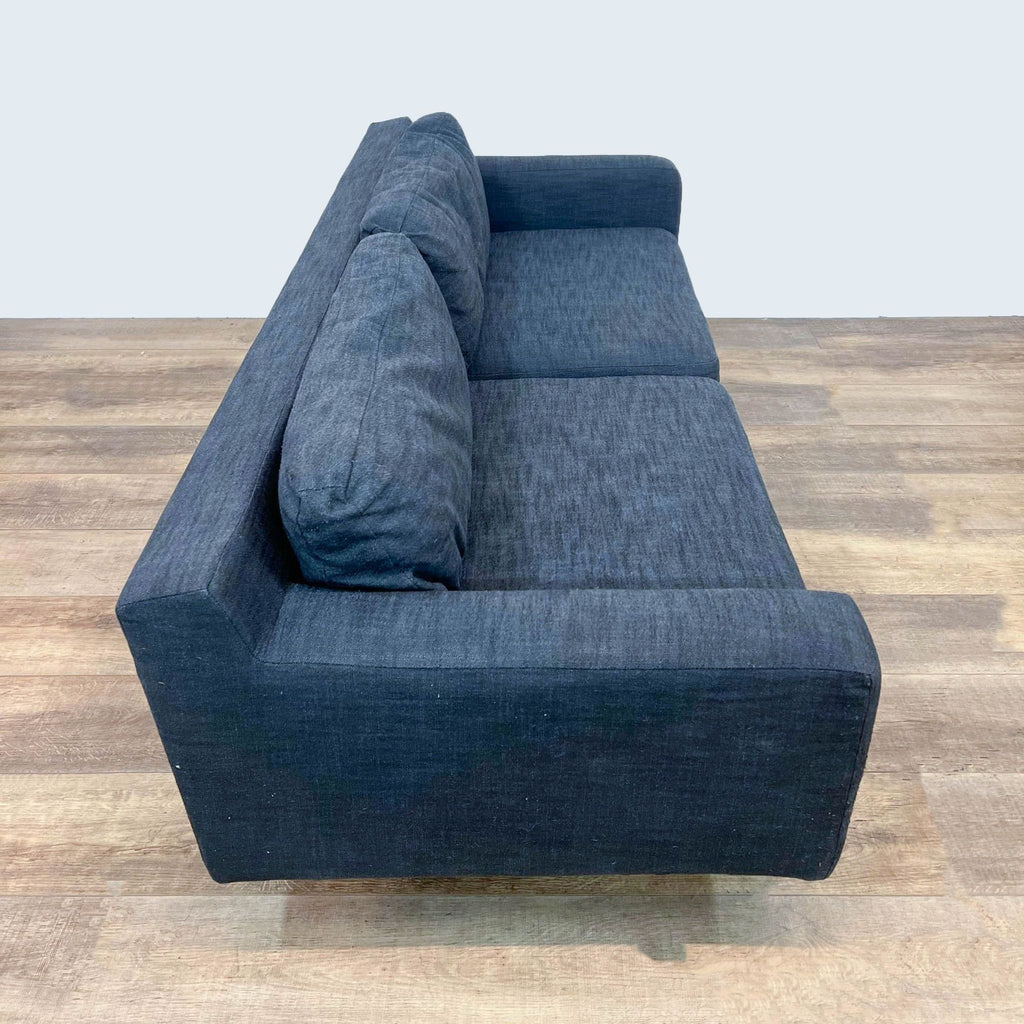 Reperch sofa featuring track arms and a minimalist design.