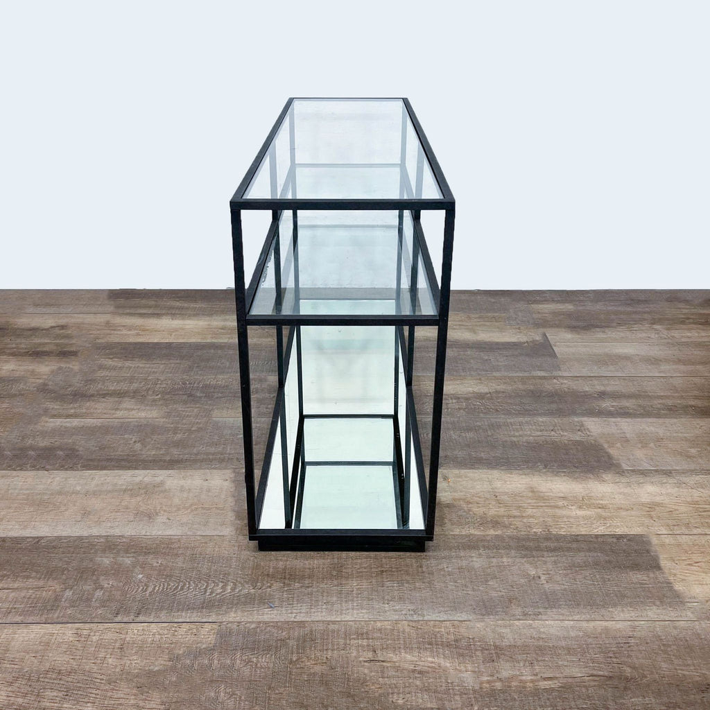 Narrow view of the metal-framed glass and mirrored shelf table.