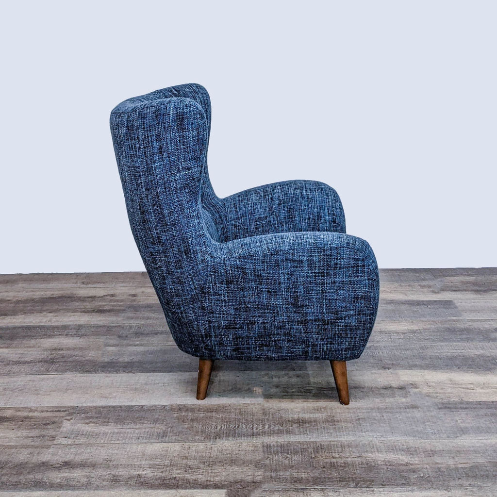 Side view of the Article Mod chair, showcasing deep seat and wood feet.