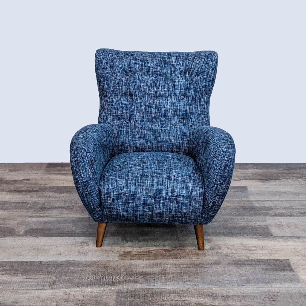 Front view of the Mod chair by Article, featuring curved arms and button tufting.