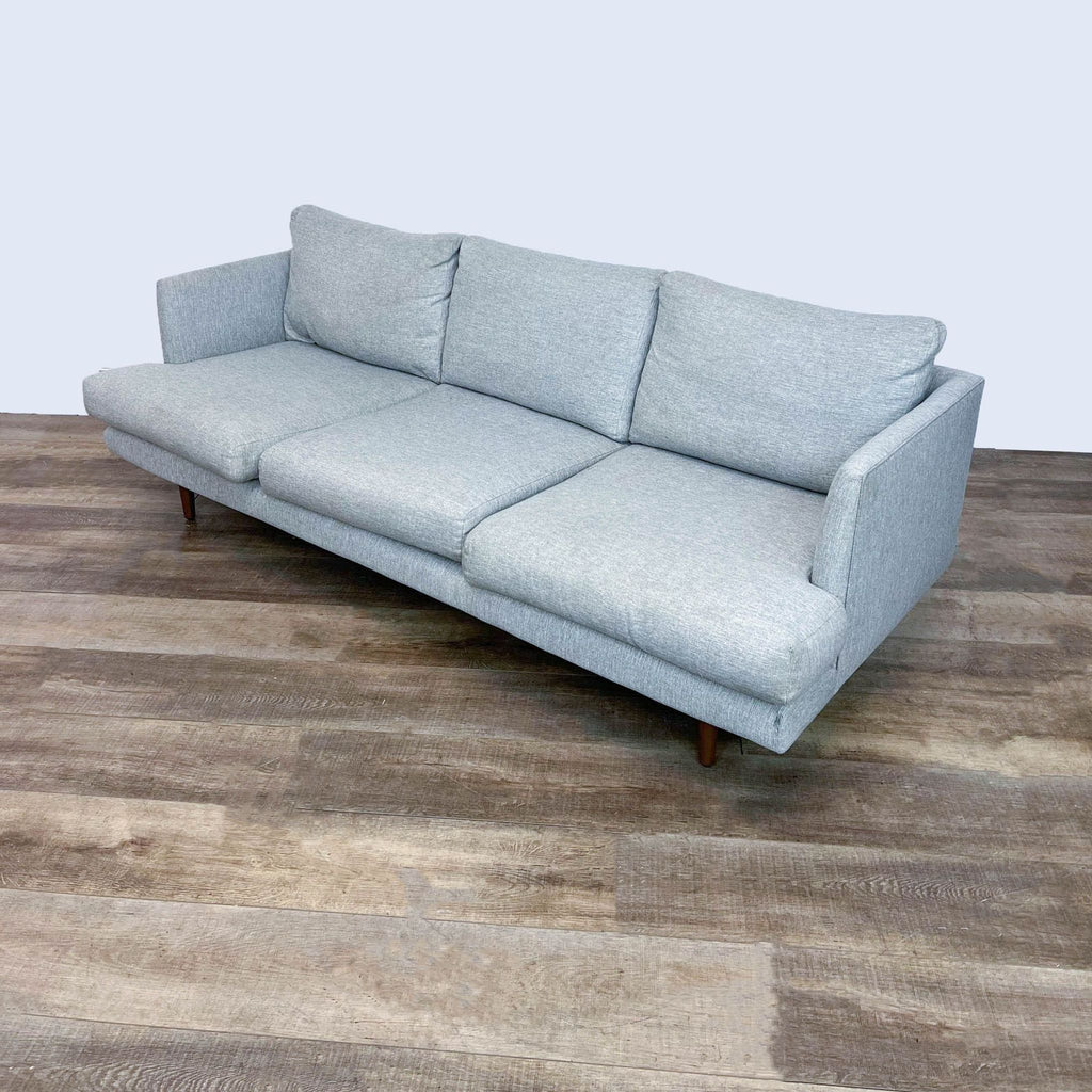 2. Article brand modern 3-seat light gray sofa featuring slim arms and walnut wood legs, seen at an angle.  