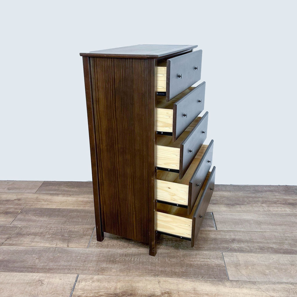 Wooden dresser with five drawers, metal glides, and replaceable knobs; modernized classic style.