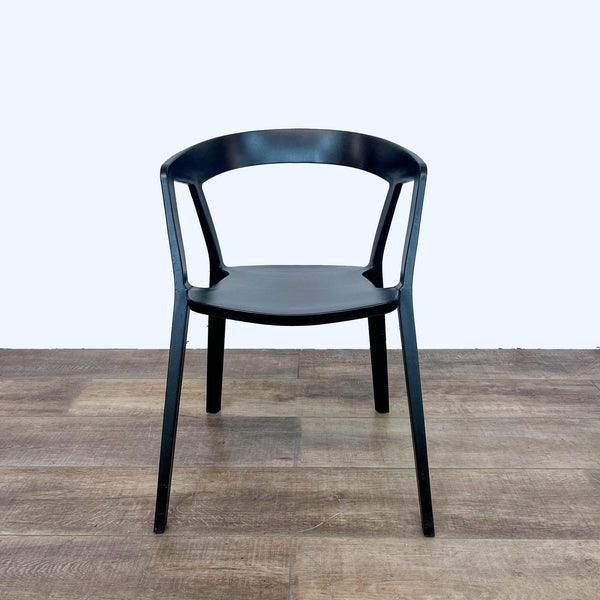 Front view of black Compas Armchair on hardwood floor by Rove Concepts.