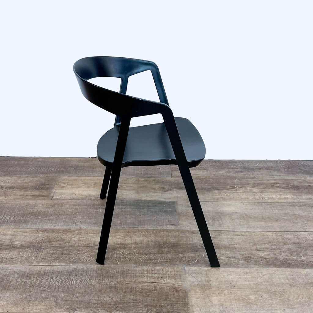 Side view of black Compas Armchair showcasing its sleek, geometric design by Rove Concepts.