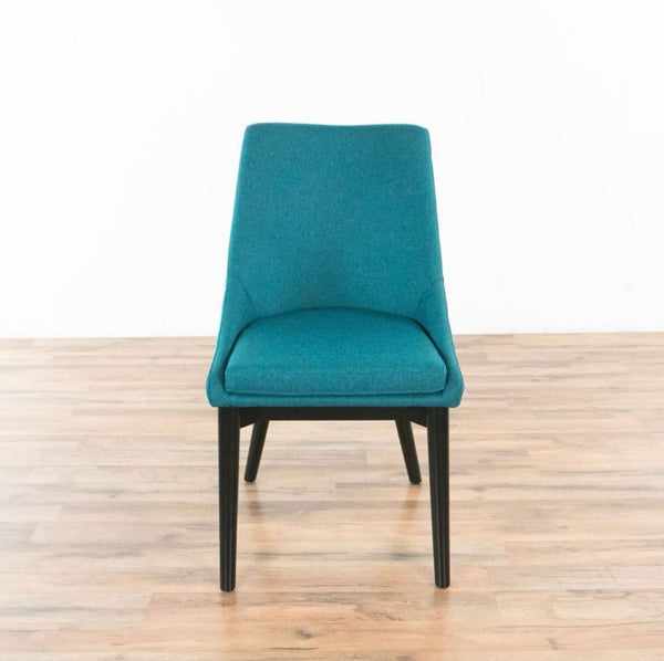 Front view of teal Viscount side chair with black tapered legs.