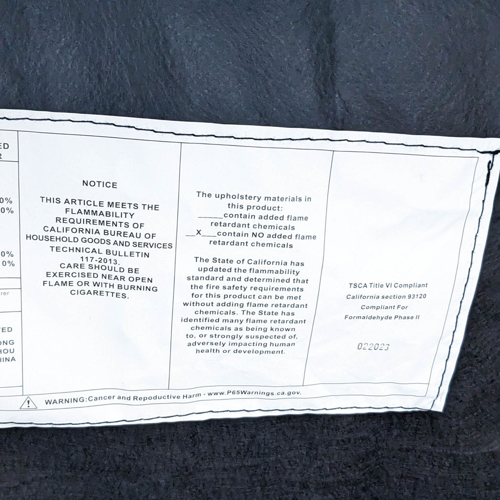 Flammability compliance label for a sofa, detailing safety standards.