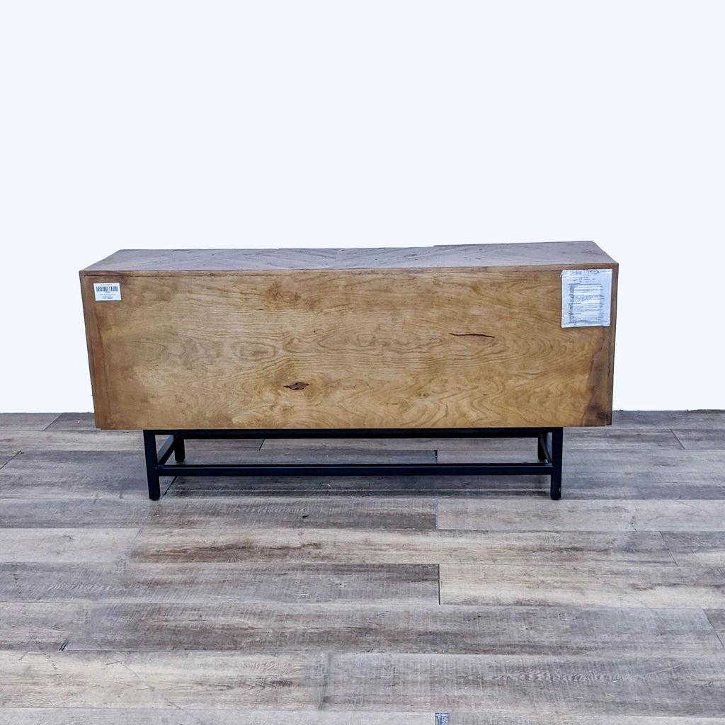 Back view of pine wood sideboard on black metal legs, showcasing the flat wood finish.