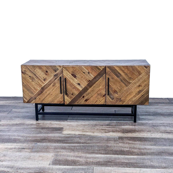 Front view of a brown reclaimed pine sideboard with black legs and steel handles.