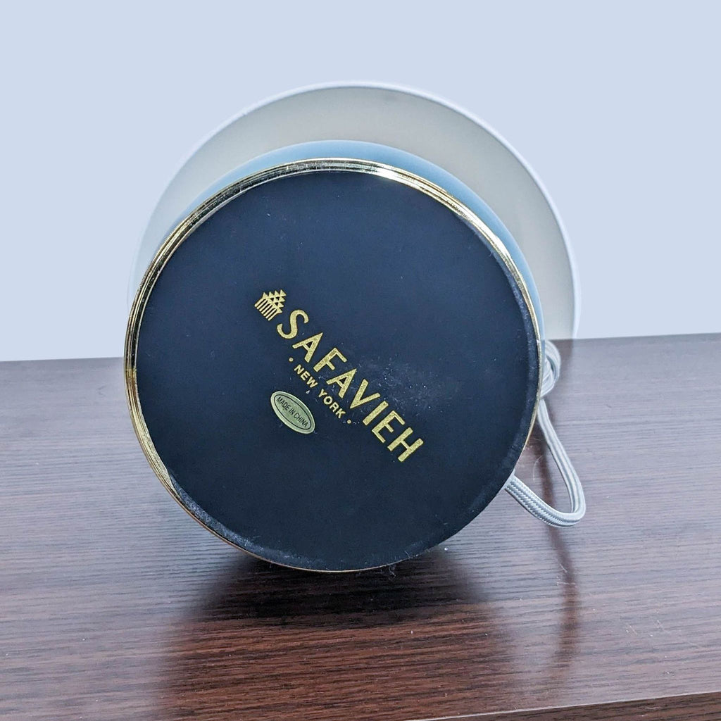 Safavieh lamp base with brand logo, shown upside down.