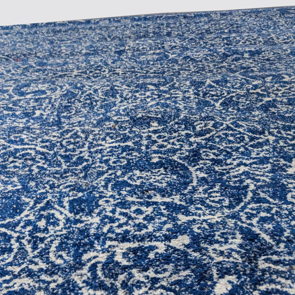 Close-up of nuLOOM rug's detailed blue and white Oriental design.