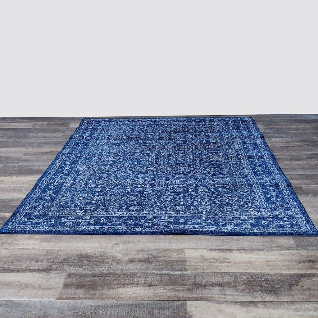 nuLOOM 6’7”x9’ dark blue rug with intricate Oriental pattern.