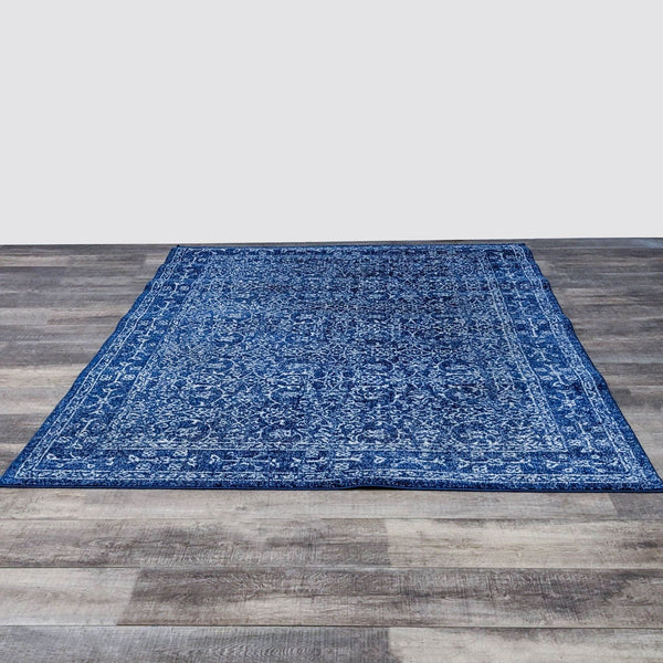 nuLOOM 6’7”x9’ dark blue rug with intricate Oriental pattern.