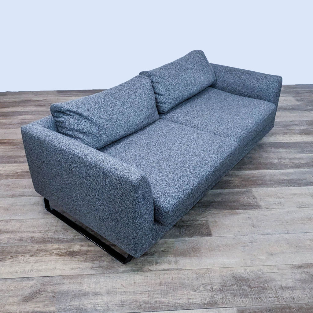 Side view of gray Reperch 3-seat sofa showcasing its sleek design and metal frame.