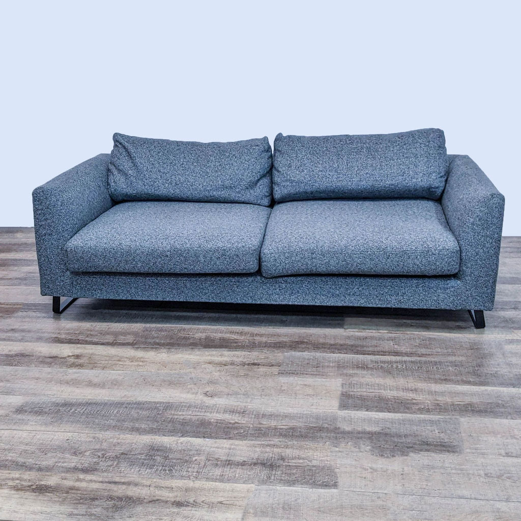 Modern gray 3-seat sofa with metal legs, brand Reperch, on wooden flooring.