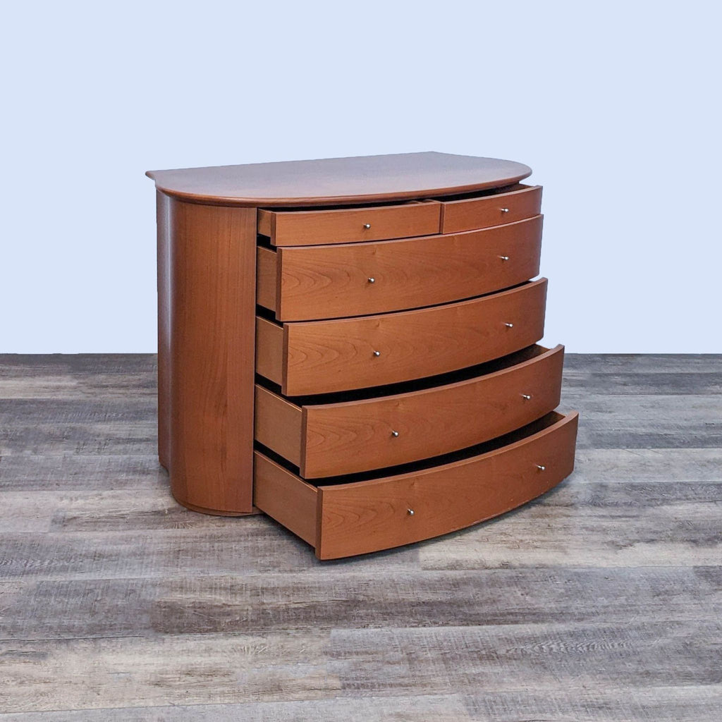 Six-drawer cherry wood dresser with some drawers open, showcasing its curved design.