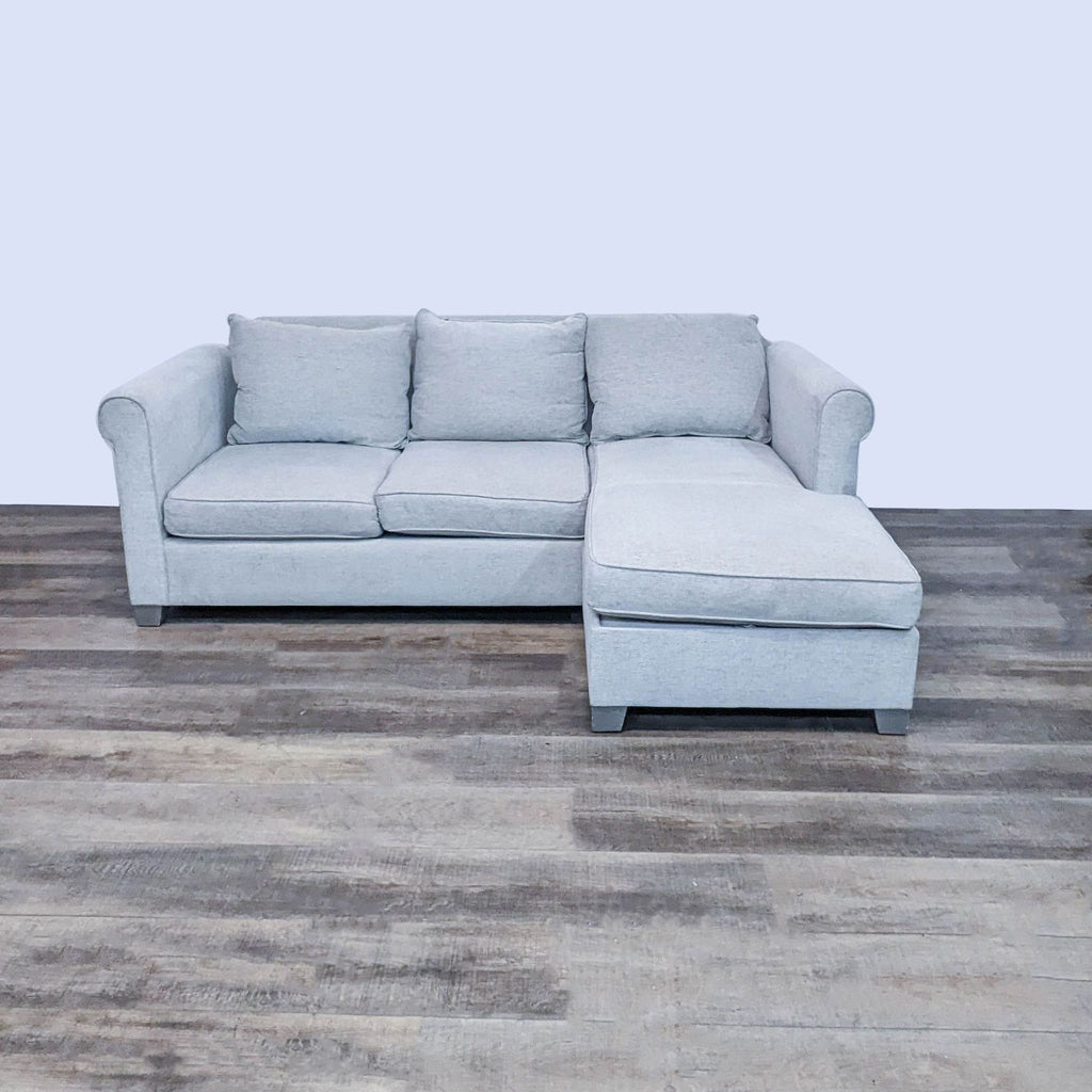 Compact 84" sectional featuring storage chaise, viewed from the front.  