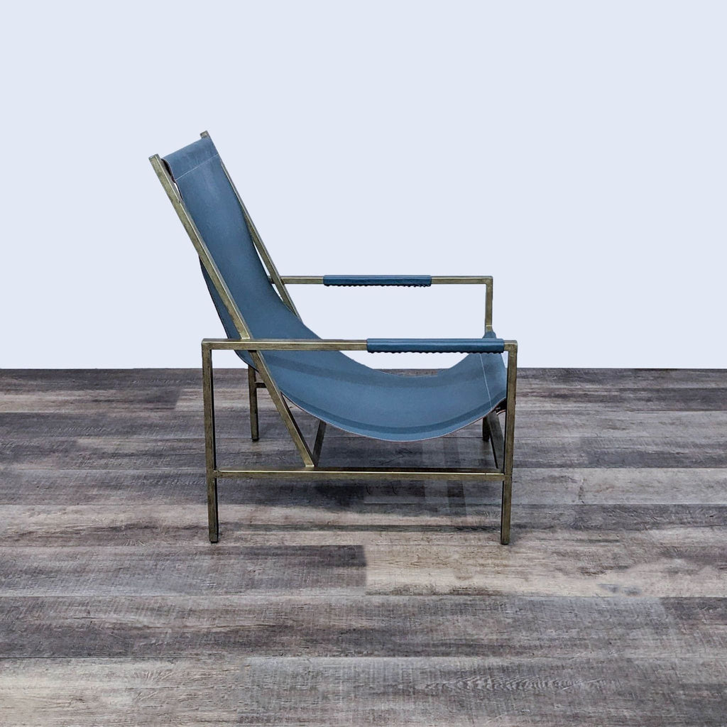 Side view of the Wright sling chair by One Kings Lane, showing angular metal frame and leather seat.