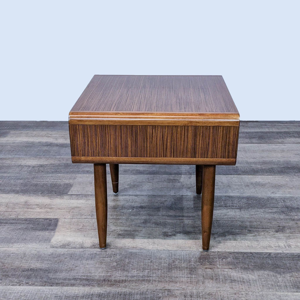 Square wooden end table with fine stripe pattern and tapered legs by Reperch.  