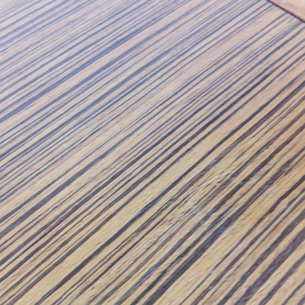 Close-up of wooden surface showing a detailed striped pattern.
