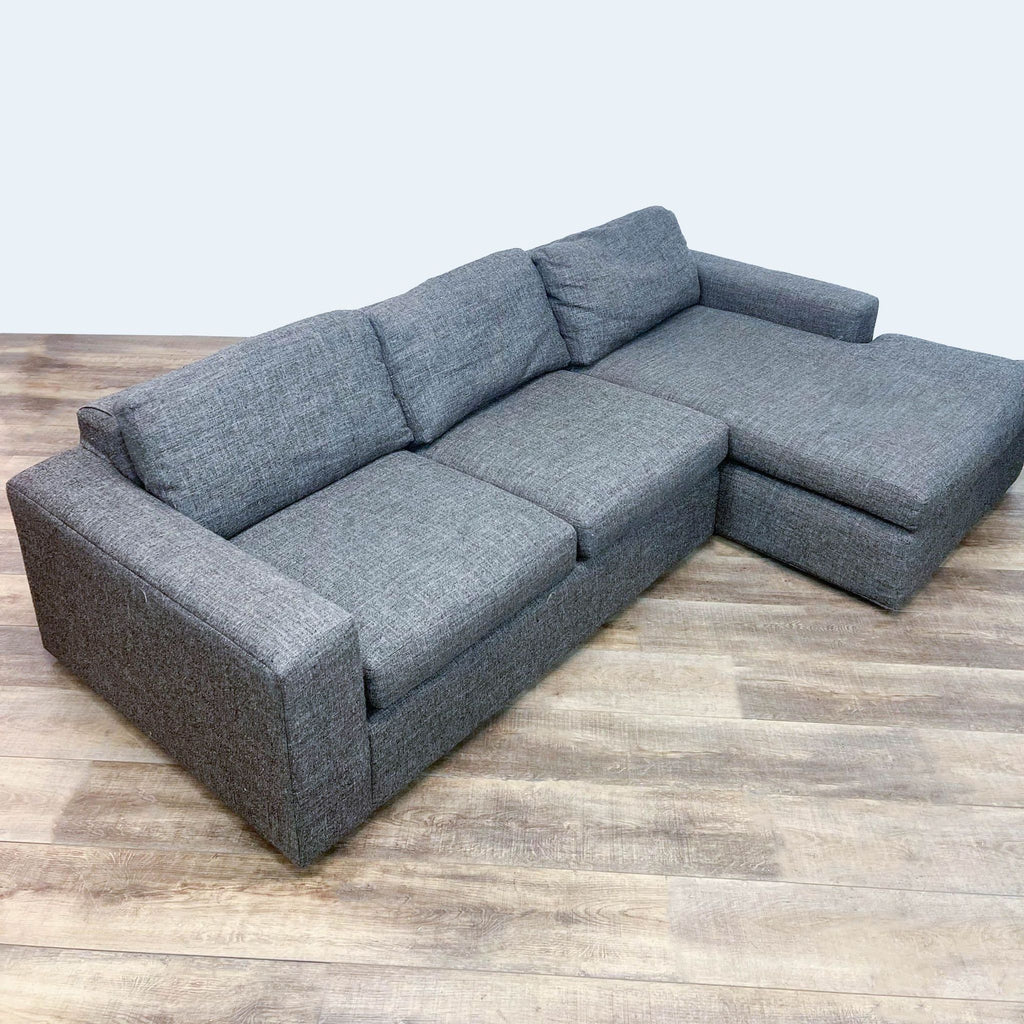 Room & Board gray sectional sofa with chaise; features block arms and fabric upholstery.