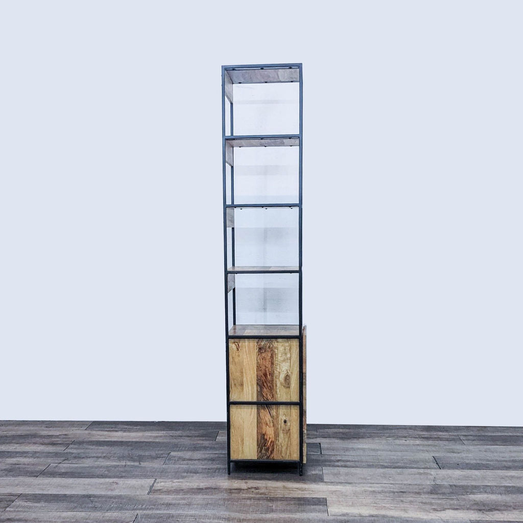 Side view of the West Elm bookshelf, showcasing its rustic wood and steel design.
