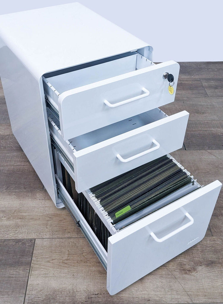 Open Poppin cabinet showing steel interior with organized file storage.