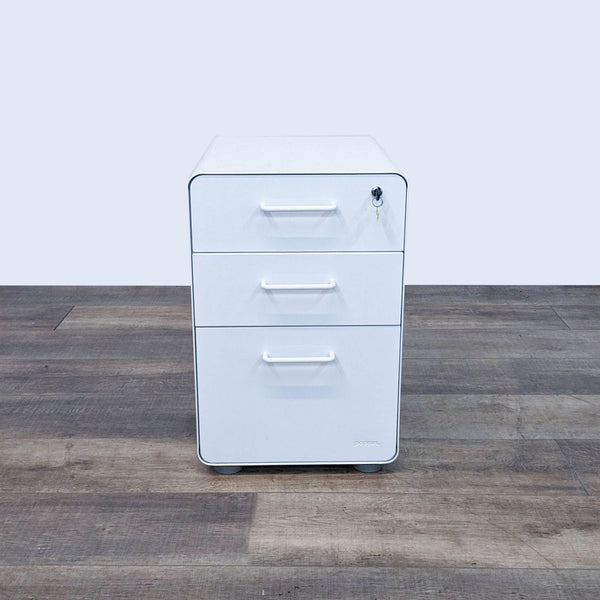 Poppin file cabinet with lockable drawers and 360° swivel casters.