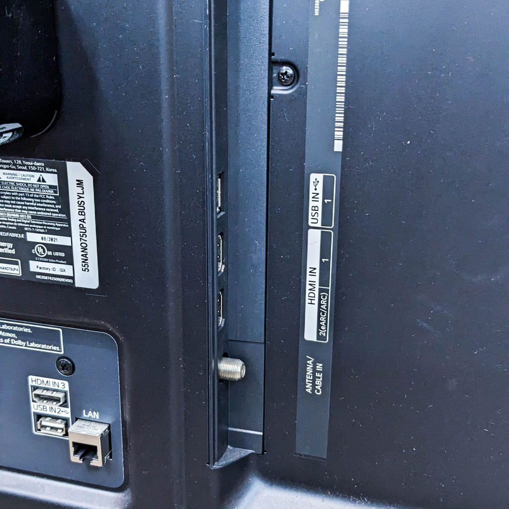 Close-up of LG TV's ports including HDMI and USB connections.