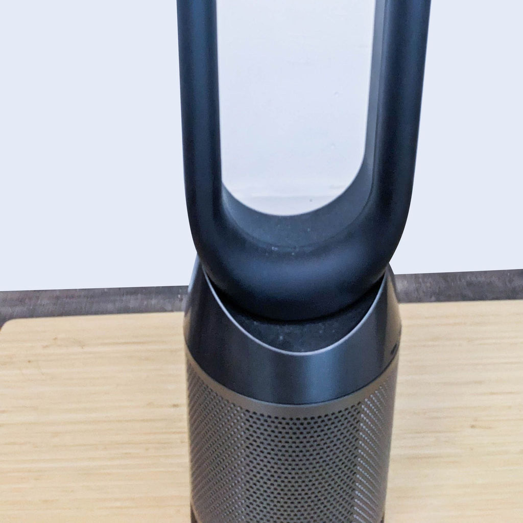 Close-up of Dyson fan's top loop design, showcasing its sleek build.