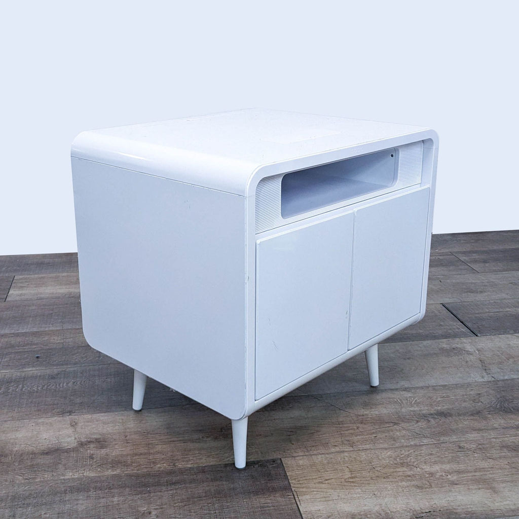 White modern cabinet with rounded edges, featuring a sleek design, suitable for home use.