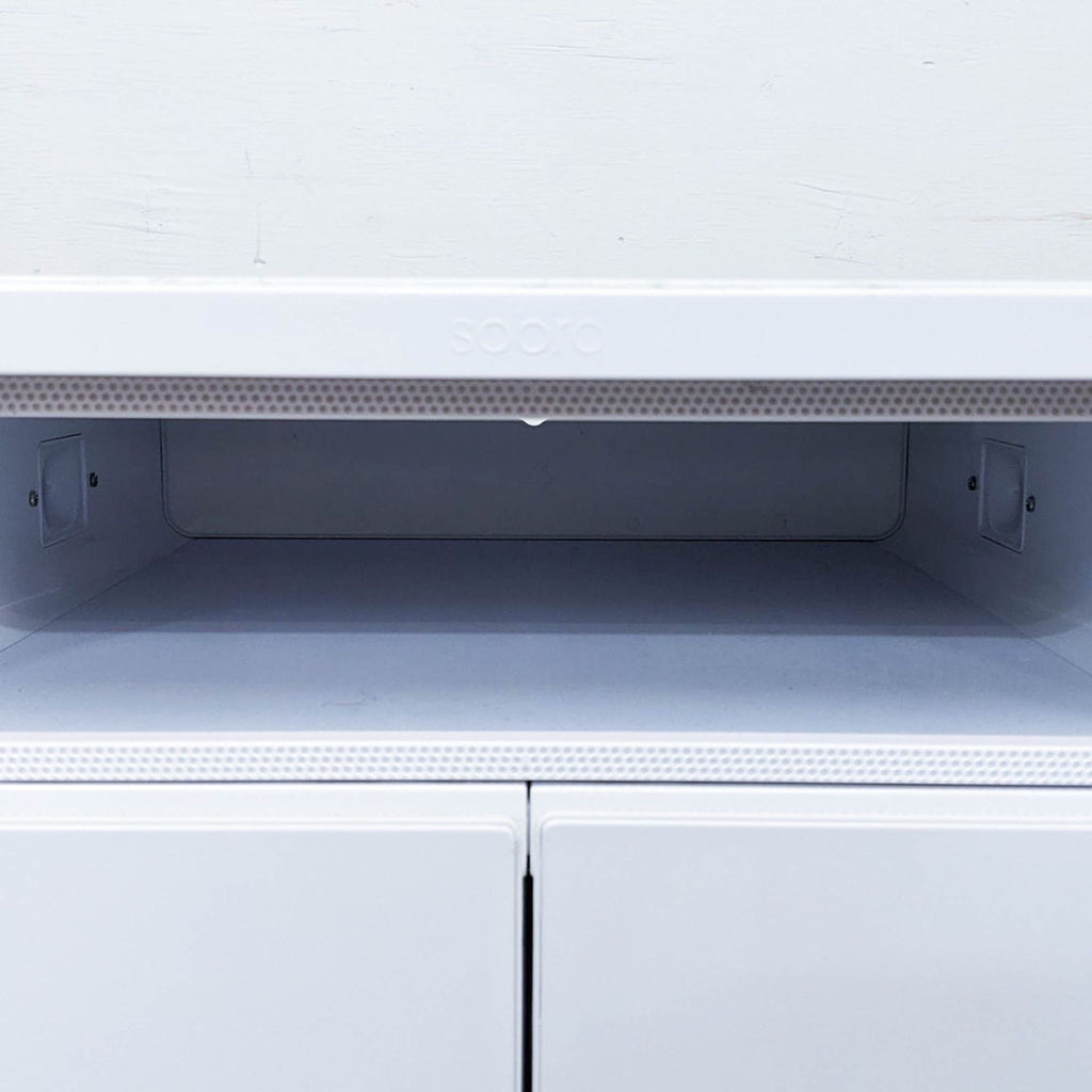 Close-up of cabinet's Bluetooth speakers, highlighting upper section designed for rich sound.