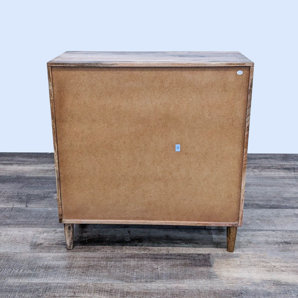 Back view of the Reagan dresser by Urban Outfitters, showcasing the natural wood finish.