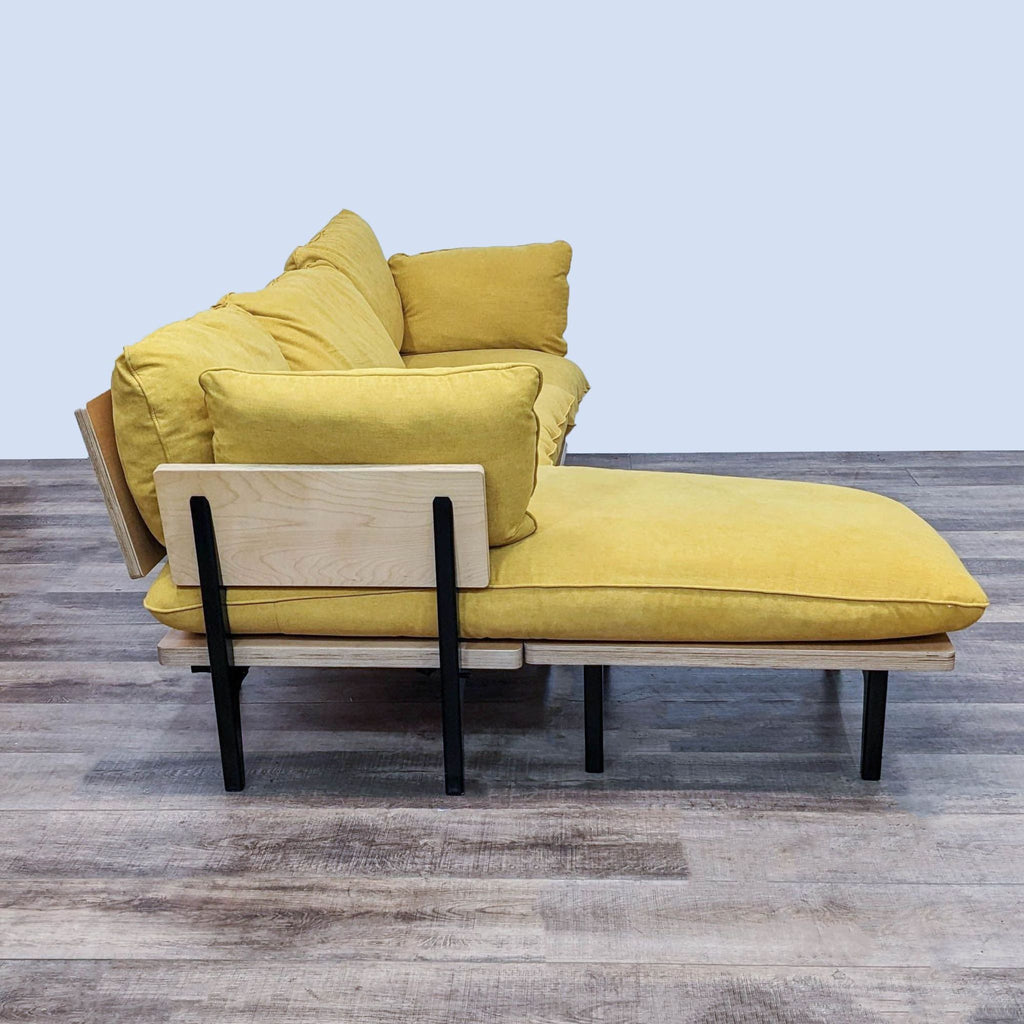 Three-seater sectional in stain-resistant saffron upholstery, featuring a reversible chaise and birch frame.