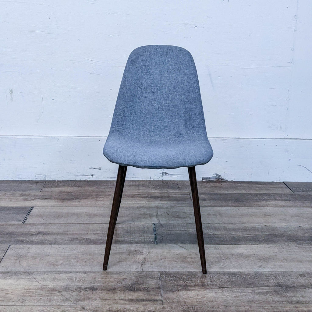 Mid-century style dining chair with curved wood seat and metal legs.