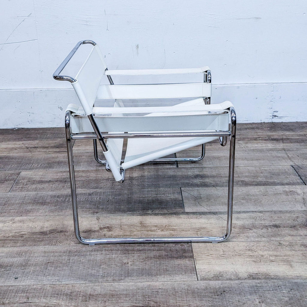 Side view of a sleek, chrome-framed chair featuring white cowhide leather seating, placed on wooden flooring.
