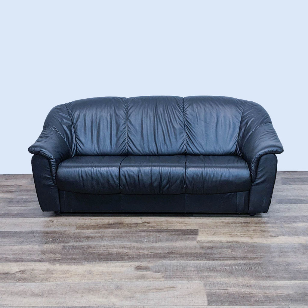 Black leather 3-seat sofa with high back and pillow top arms by Reperch.