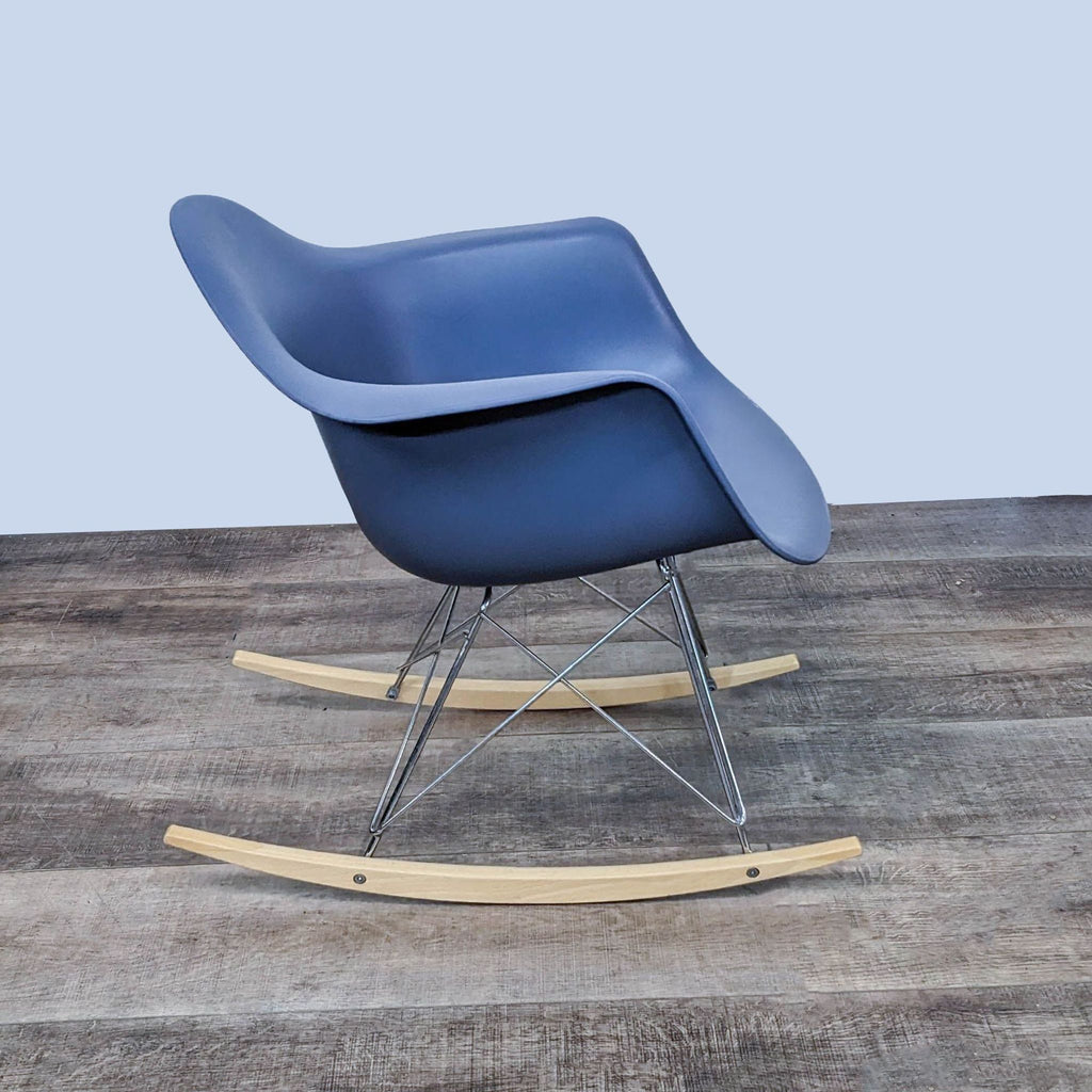 Blue plastic modern rocker with wooden legs and chrome supports.