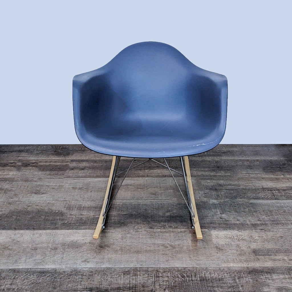 Stylish polypropylene chair with wooden rockers and chrome base.