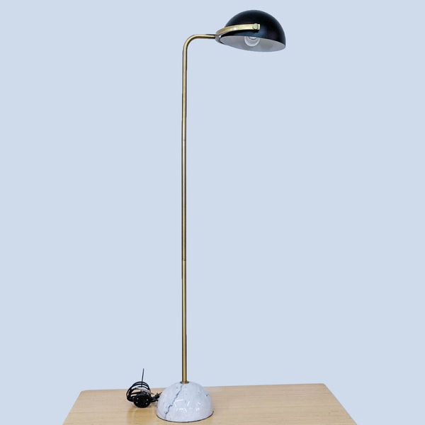Reperch lamp with a marble base and sleek design.