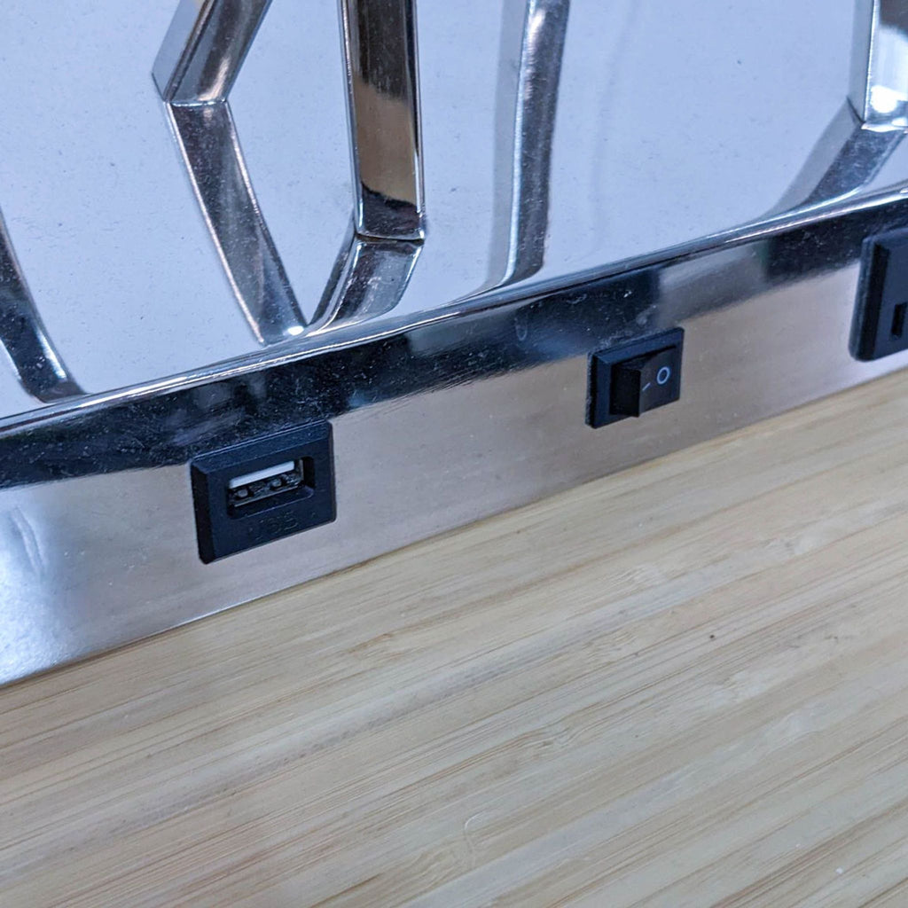 Close-up of power and USB ports on Reperch lamp base.