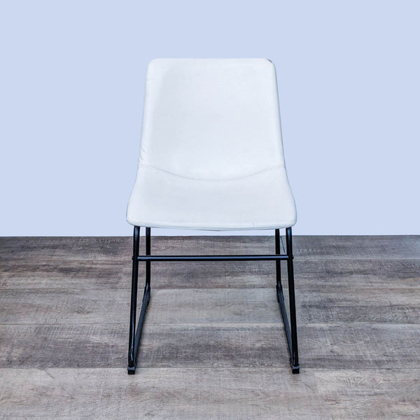 Front view of Zuo Modern Smart dining chair, sleek design with matte black metal frame.
