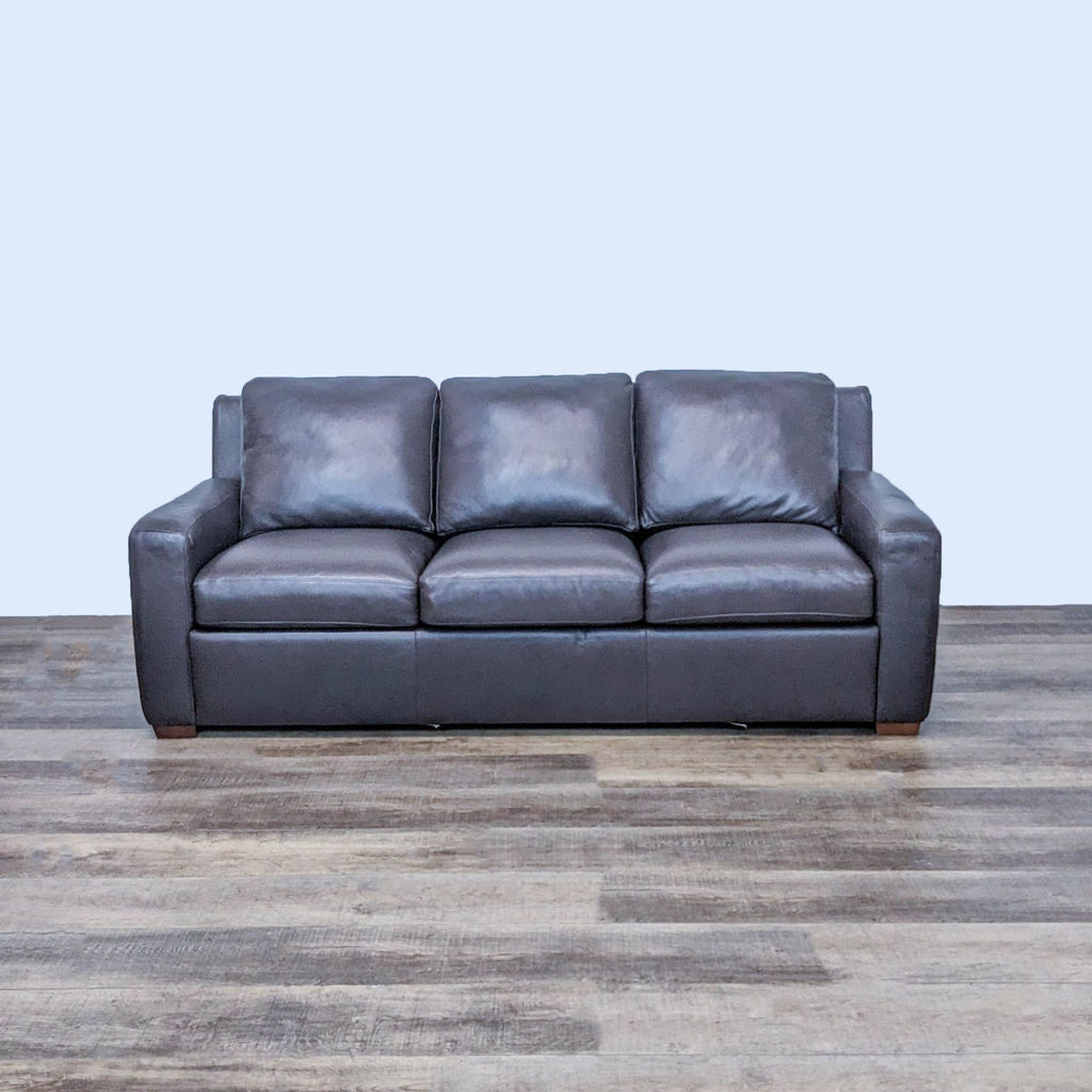 Brown leather 3-seat sleeper sofa, sleek design, by American Leather.