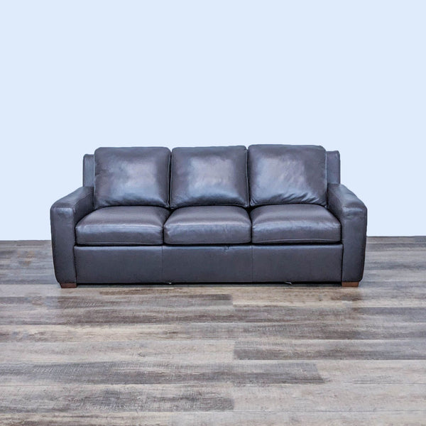 Brown leather 3-seat sleeper sofa, sleek design, by American Leather.