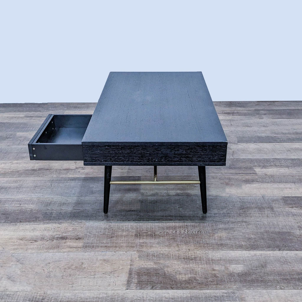 Reperch brand coffee table, dark wood with open drawer on laminate flooring.